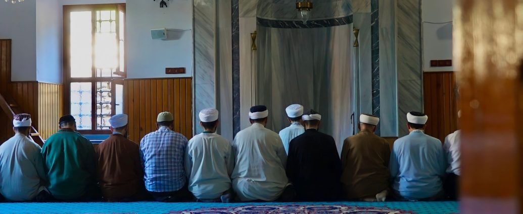 people kneeling on the floor praying