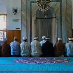 people kneeling on the floor praying
