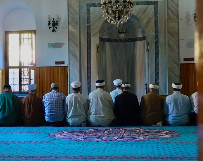 people kneeling on the floor praying