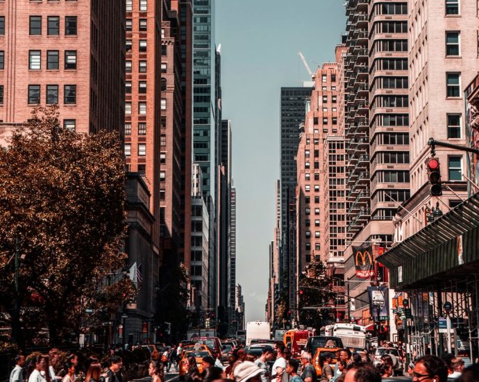 people walking near high rise buildings