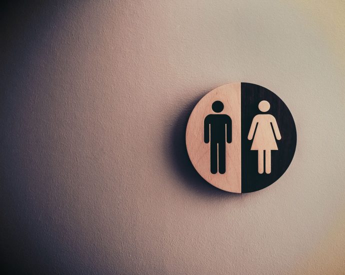 male and female signage on wall