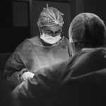 black and white operating room scene