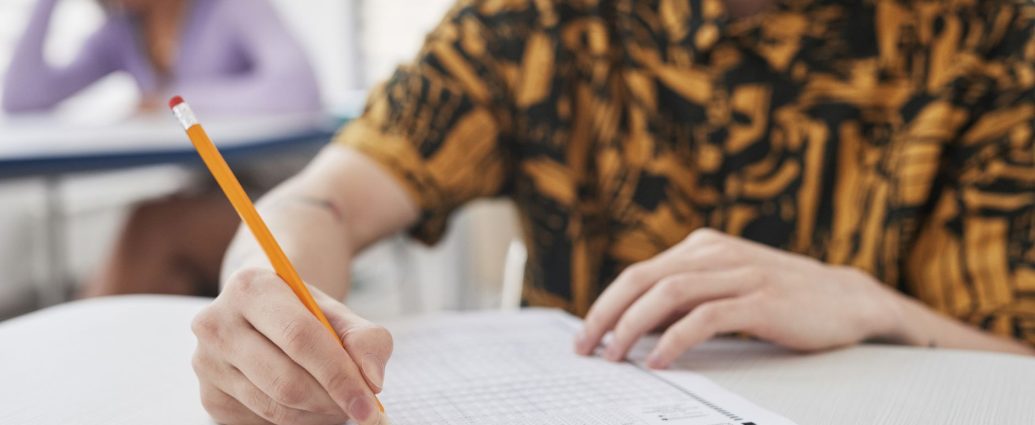 a person holding a pencil