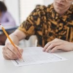 a person holding a pencil
