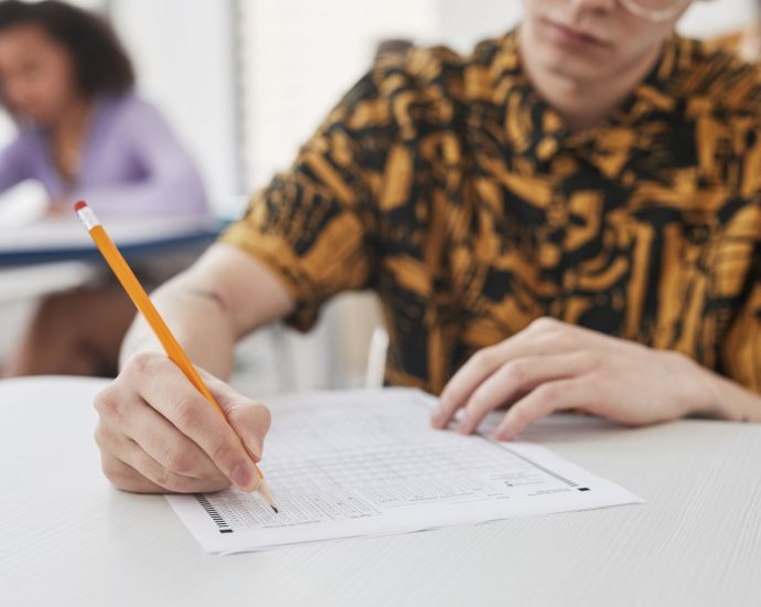 a person holding a pencil
