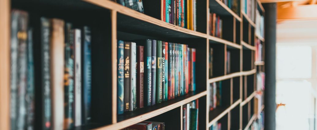books on brown wooden shelves